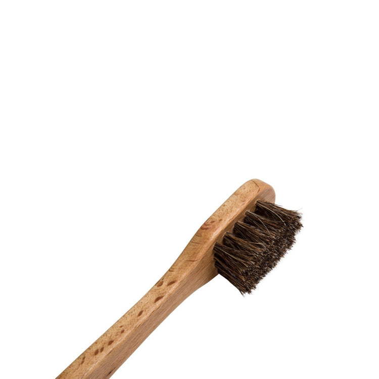 Small wooden shoe cleaning brush