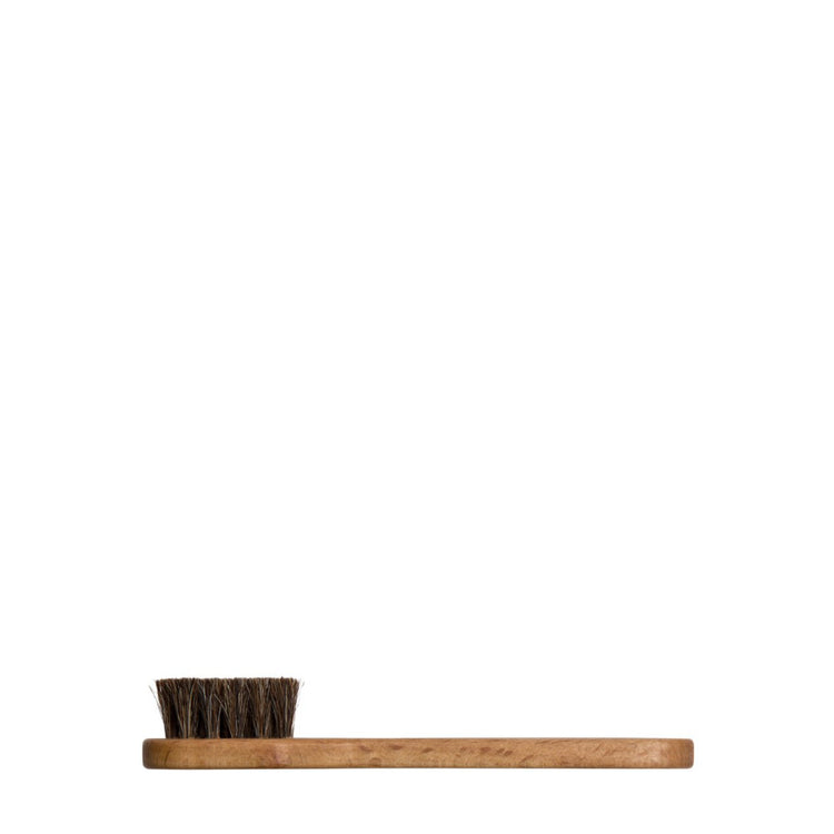Small wooden shoe cleaning brush